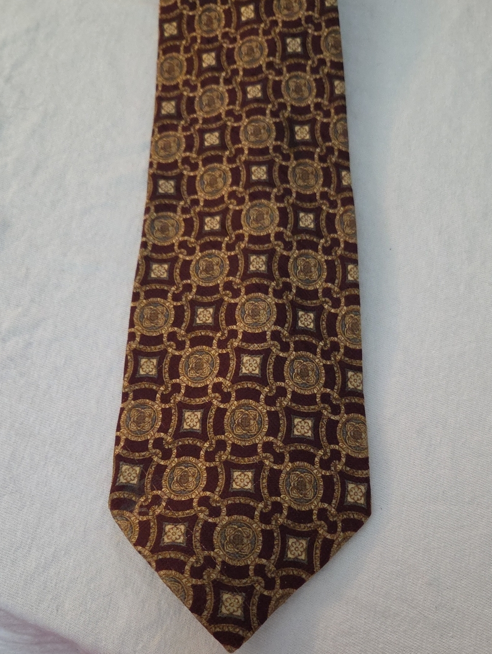 Men's Burgundy Tie with Gold Medallion Pattern